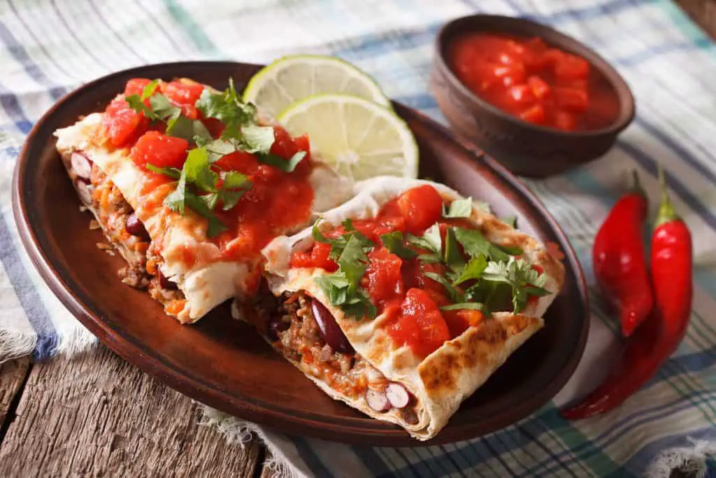 Chimichanga With Minced Meat, Vegetables And Cheese Close-up Hor