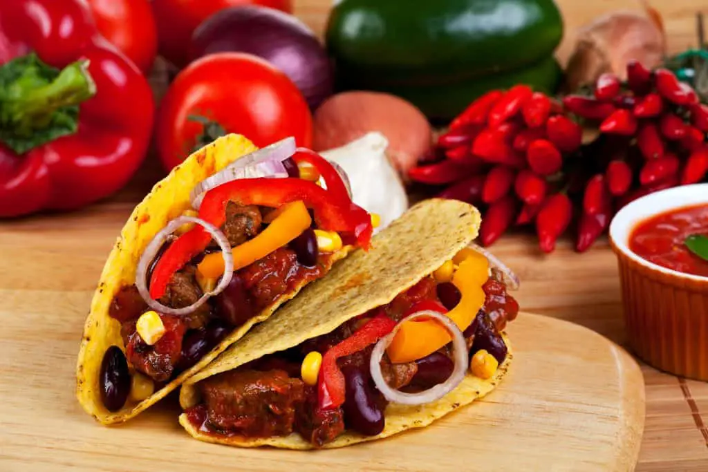 tortilla shells stuffed with meat sauce and beans