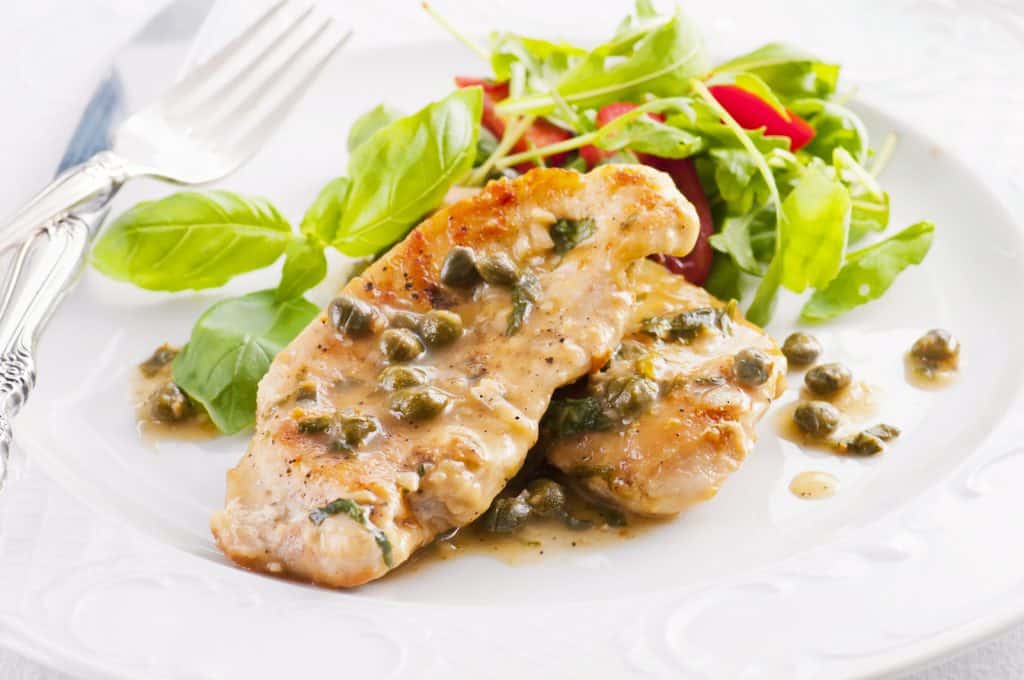 chicken piccata with capern and salad